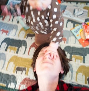 Candid Pic of the Author Having Her Face Smooshed by a Small Human